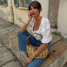 Woman in a pretty white blouse and jeans