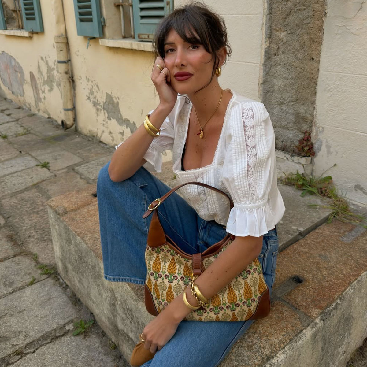 Woman in a pretty white blouse and jeans