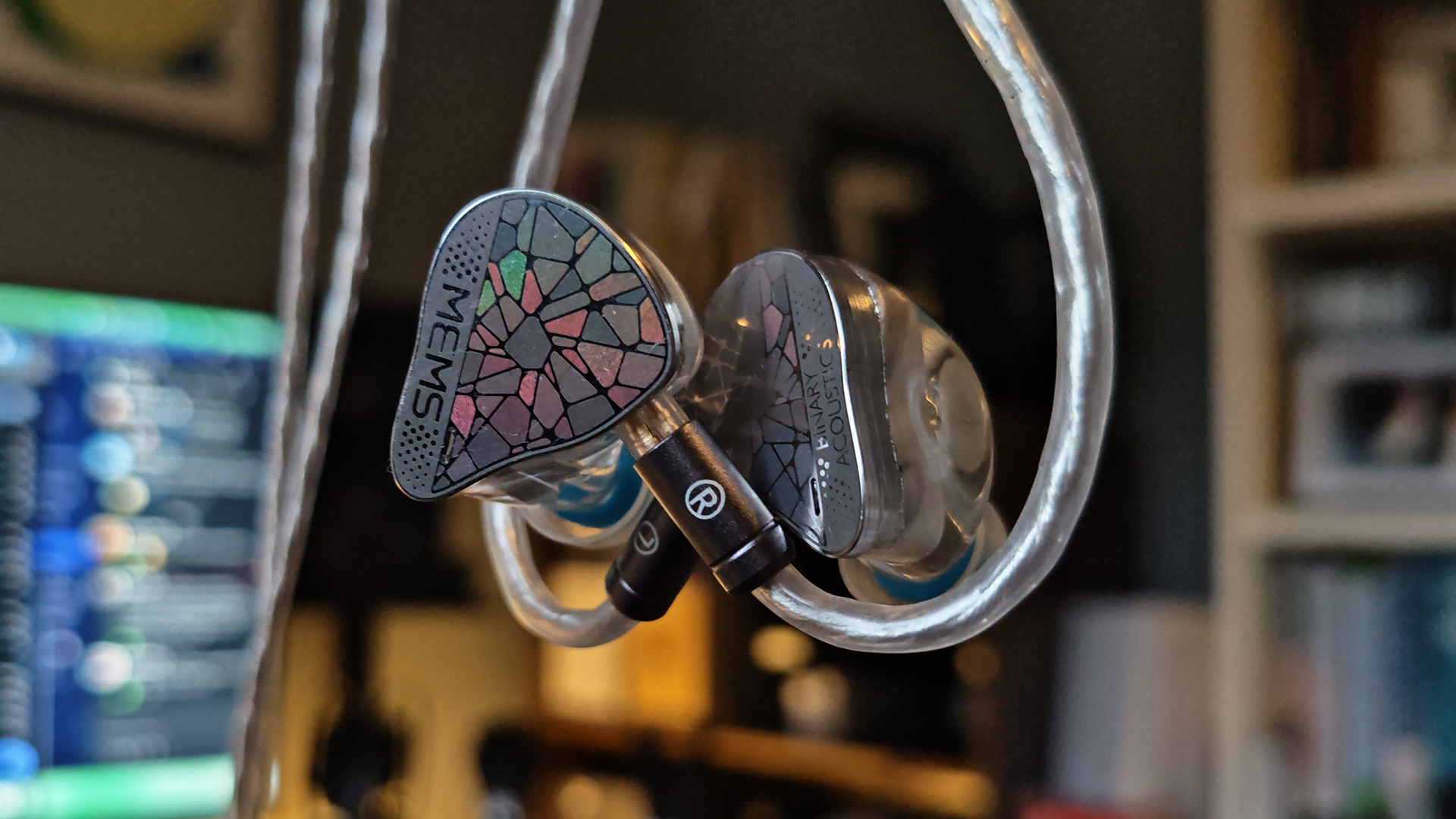 Different shots of the Binary EP321 MEMS IEMs on a home desk.