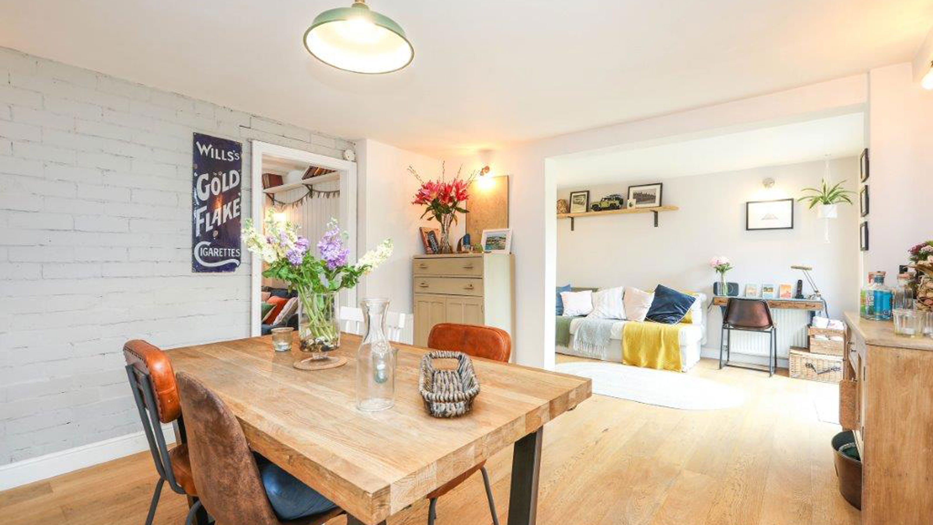 open plan dining room and snug with engineered wooden flooring