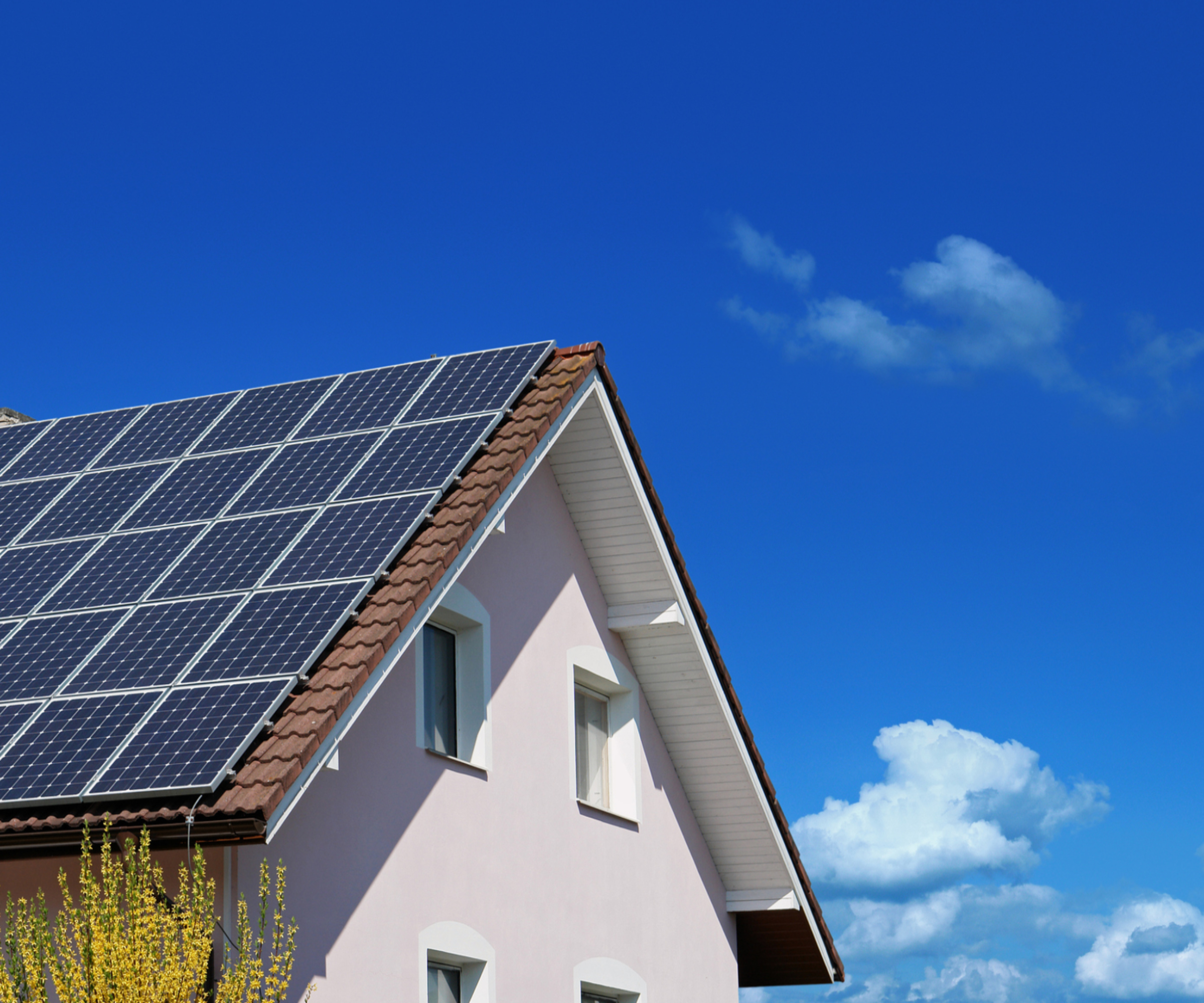 large house with roof covered in solar panels