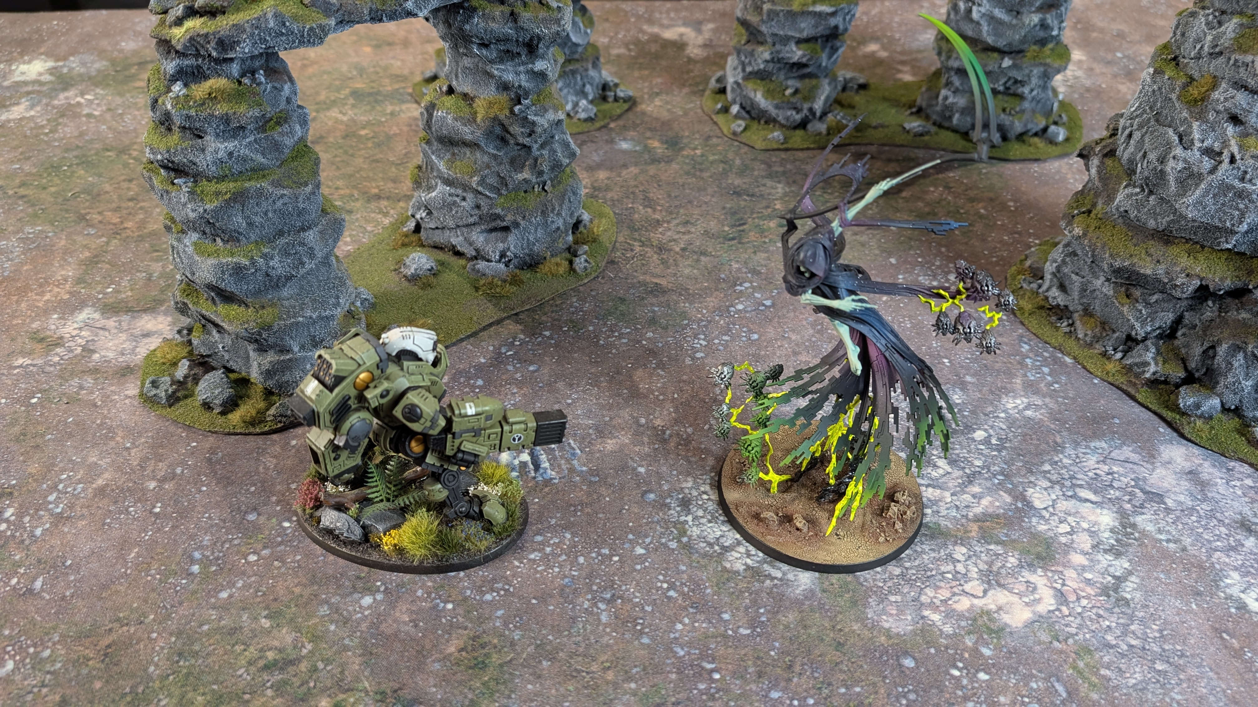 Warhammer 40,000 Necron models on a blasted, rocky battlefield