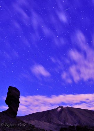 A Quadrantid meteor streaks over Mount Teide, the highest mountain in Spain, before dawn on Jan. 4, 2012 on the island of Tenerife in the Canary Islands. Amateur photographer Roberto Porto snapped this amazing photo.