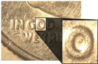 An image shows one of the tiny zircon crystals found in Australia on a US dime. Even smaller particles within the zircon encode data about the state of the Earth's magnetic field at the time the crystal formed.