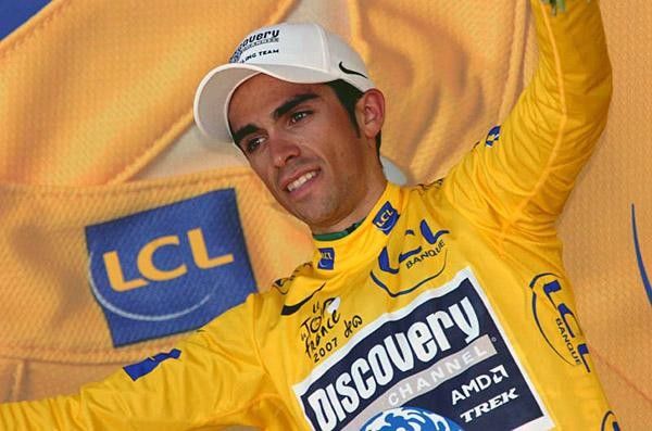 Alberto Contador looks apprehensive on the yellow jersey podium