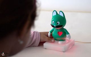 This toy character has an embedded heart shape made from a series of internal bubbles. When illuminated the embedded heart shape glows with a heartbeat-like rhythm