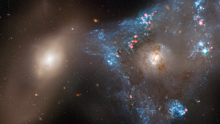 A Hubble Space Telescope image of colliding images, collectively known as Arp 143.