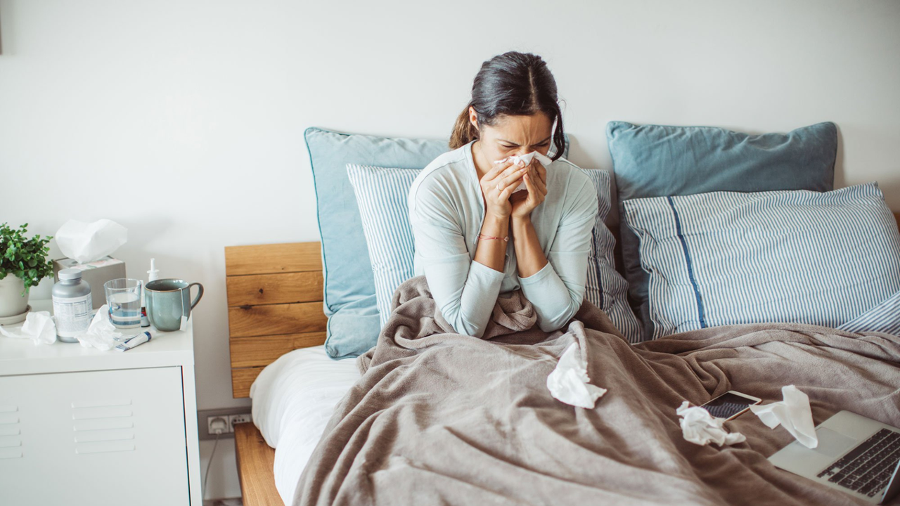 woman poorly in bed