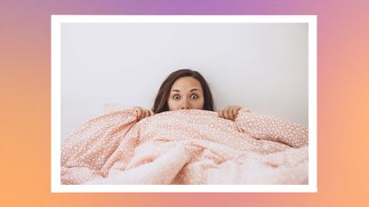 a shocked woman in bed holding a pink comforter above her face