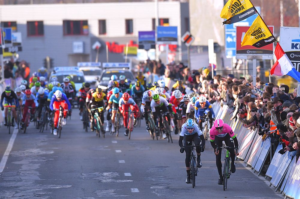 Sep Vanmarcke (EF Education First-Drapac) and Lukasz Wisniowski (Team Sky) sprint for the podium ahead of the peloton