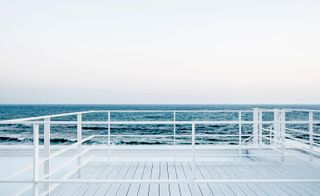 A sea view from a white rooftop