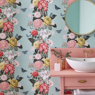 bathroom with wallpaper and mirror