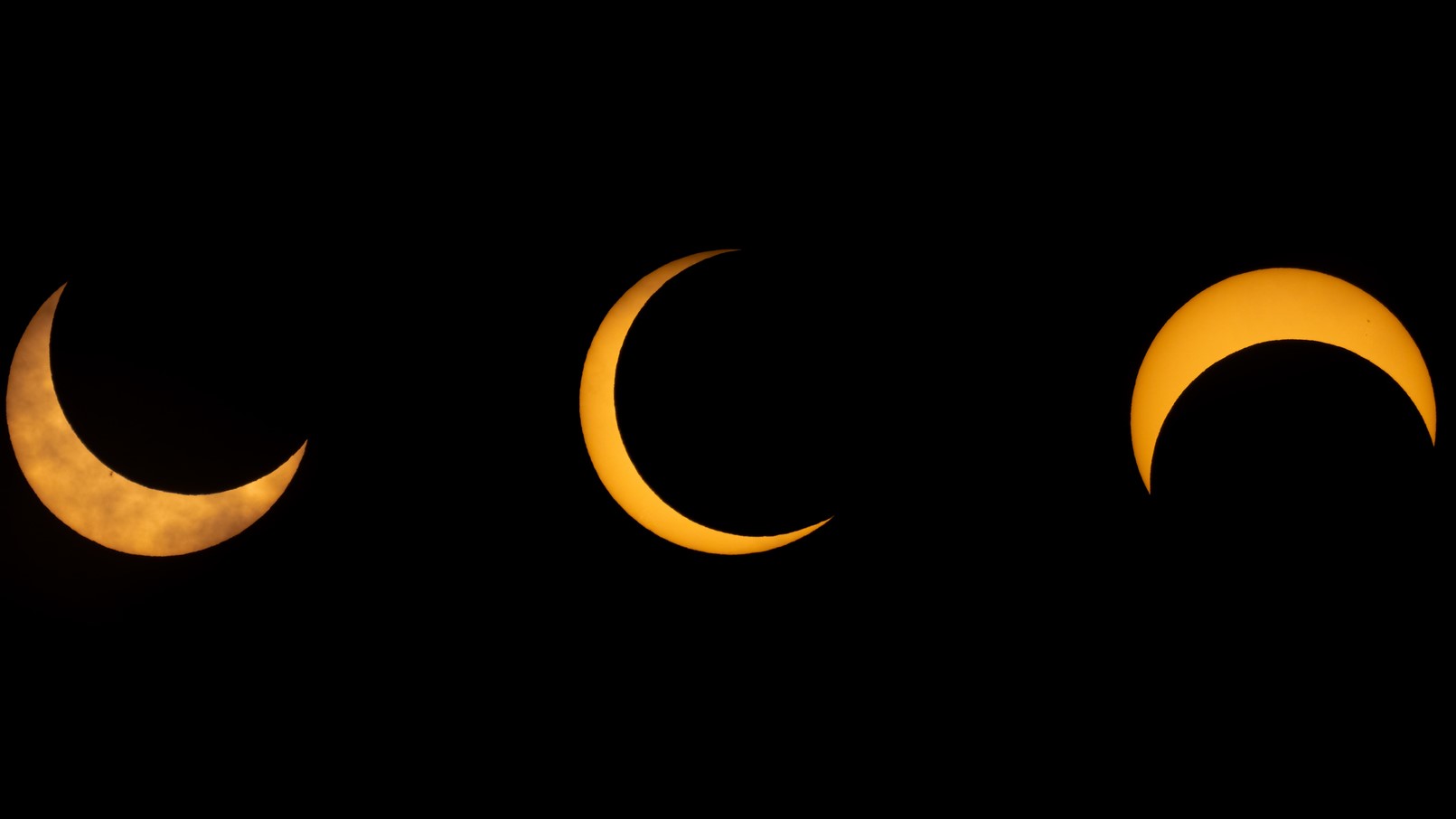 partial phases of an annular solar eclipse, showing the moon taking large 'bites' out of the sun.