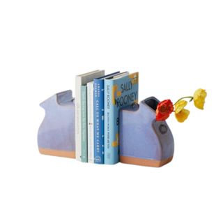 Two bookend vases with books in between