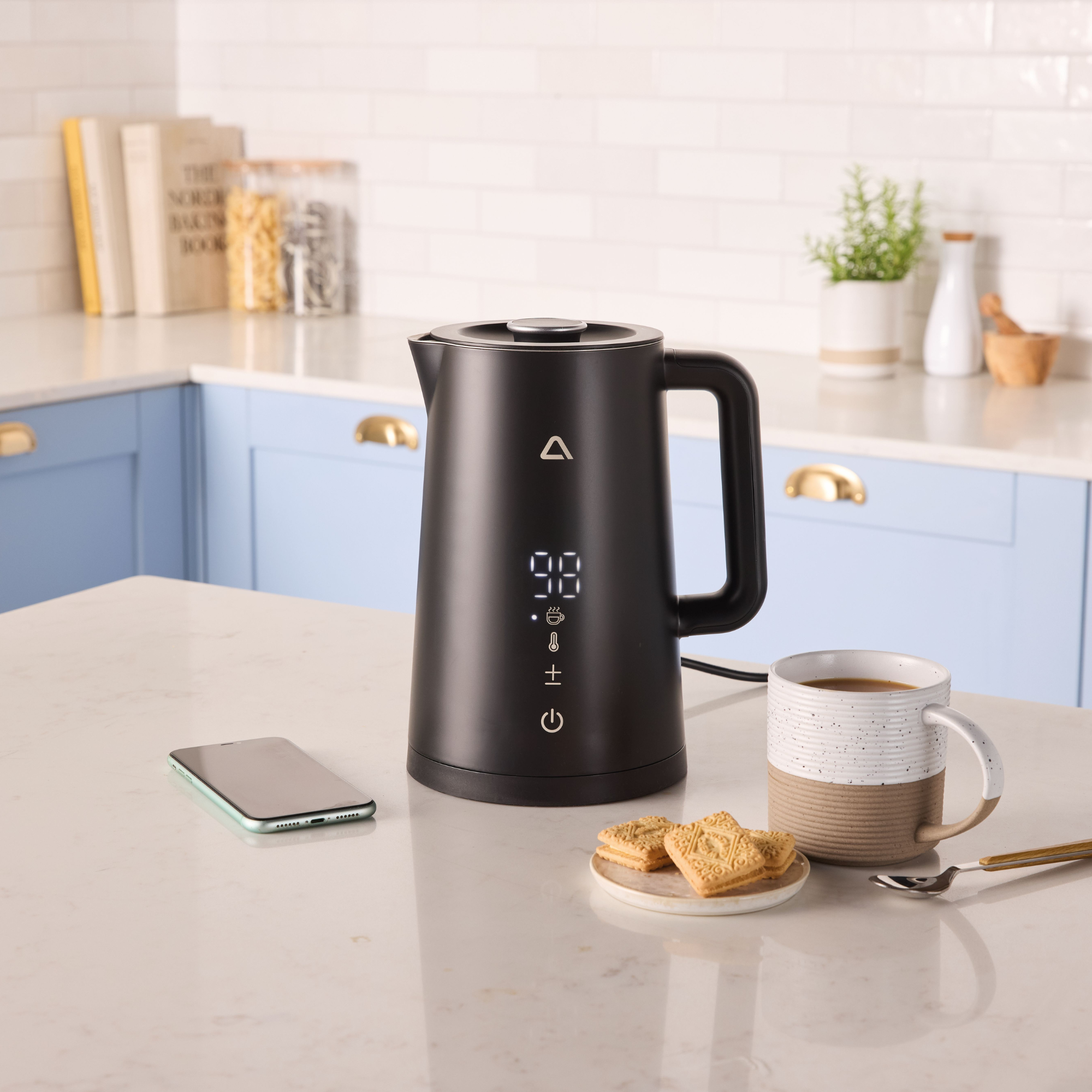 Aldi smart kettle in modern blue kitchen.