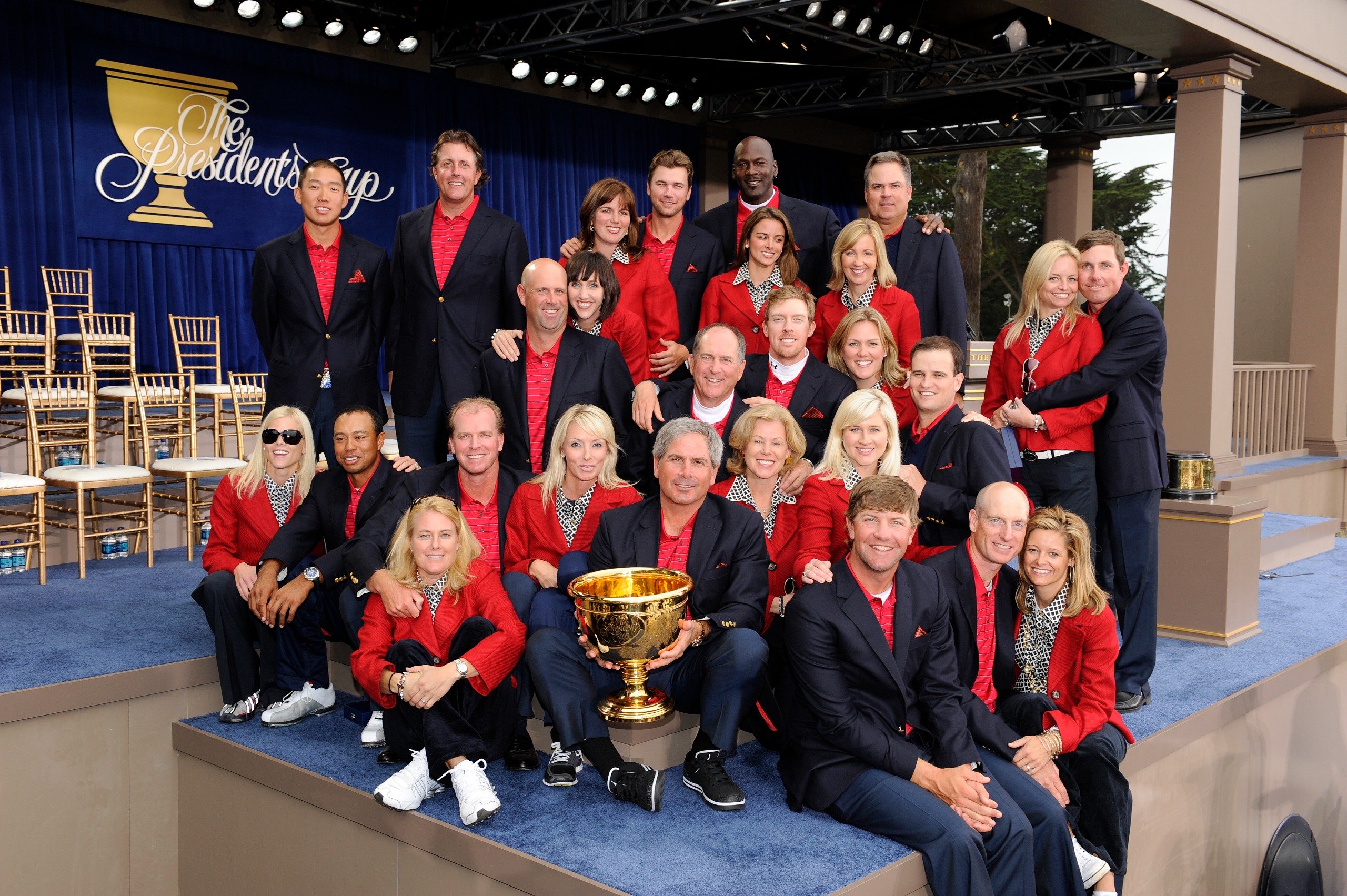 The US Team and their partners pose with the Presidents Cup after winning in 2009