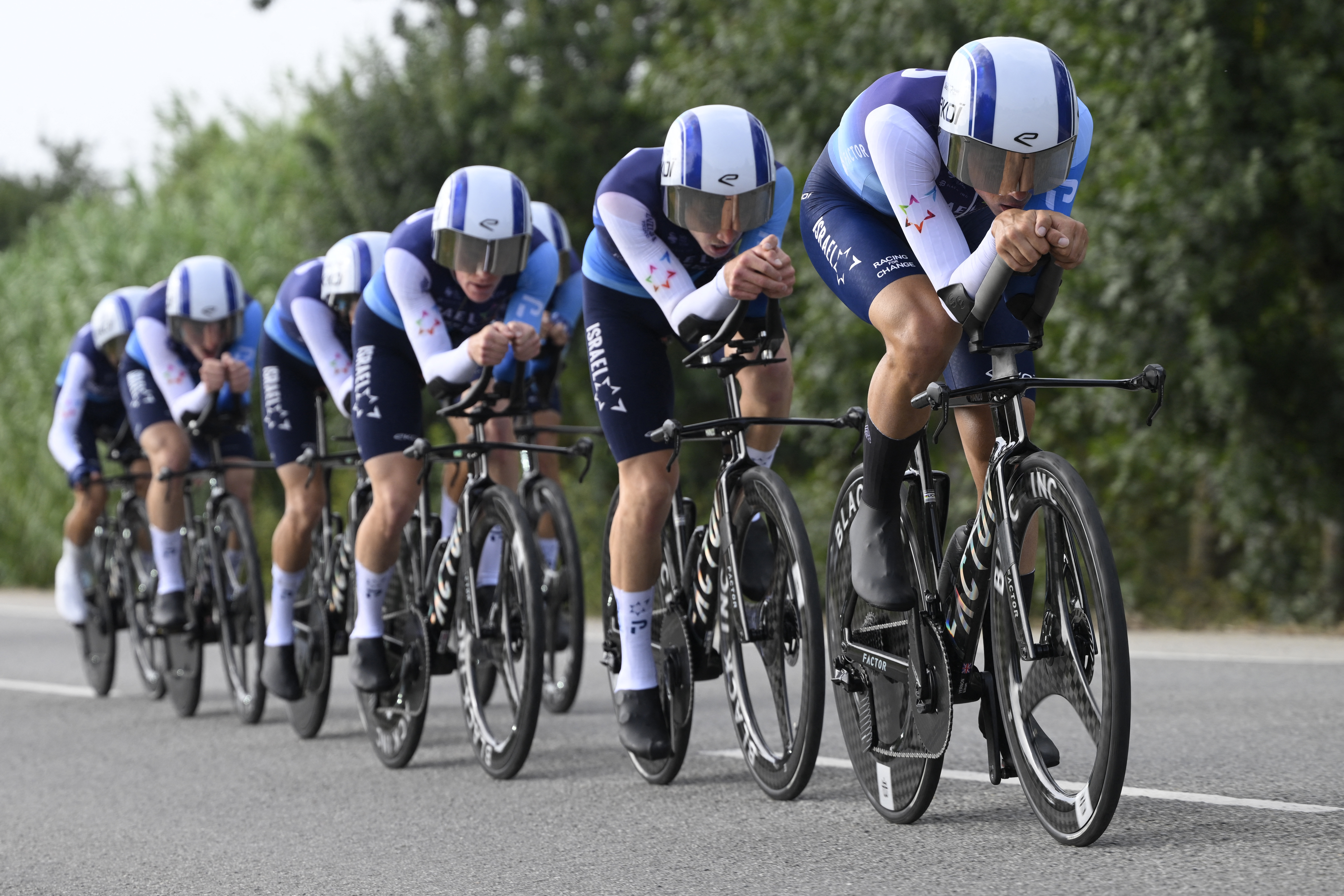 Team Israel Premier Tech &#039;s riders compete during the fifth stage of La Vuelta a Espana cycling tour, a 24.1 km time-trial team race in Figueres, on August 27, 2025. (Photo by Josep LAGO / AFP)
