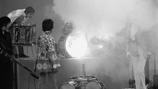 Keith Moon surveys the damage after blowing up his drum kit