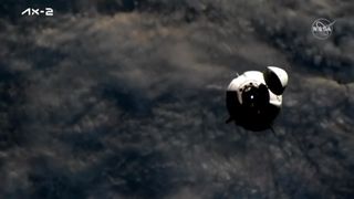 SpaceX Crew Dragon Freedom flies with clouds of Earth behind ahead of docking