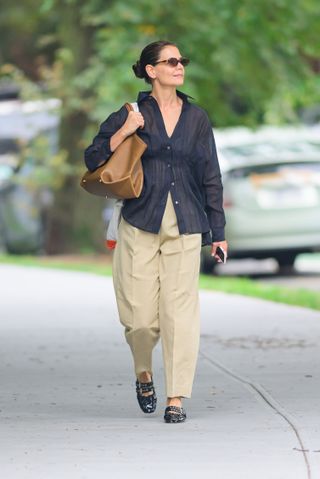 katie holmes wears khaki pants and buckled balerina flats while out in new york city