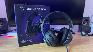 Turtle Beach Atlas Air gaming headset with box on a wooden desk