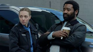 Amanda Seyfried and Nicholas Pinnock stand together against next to a car in Long Bright River - S1 E4 - "Blind Spot."