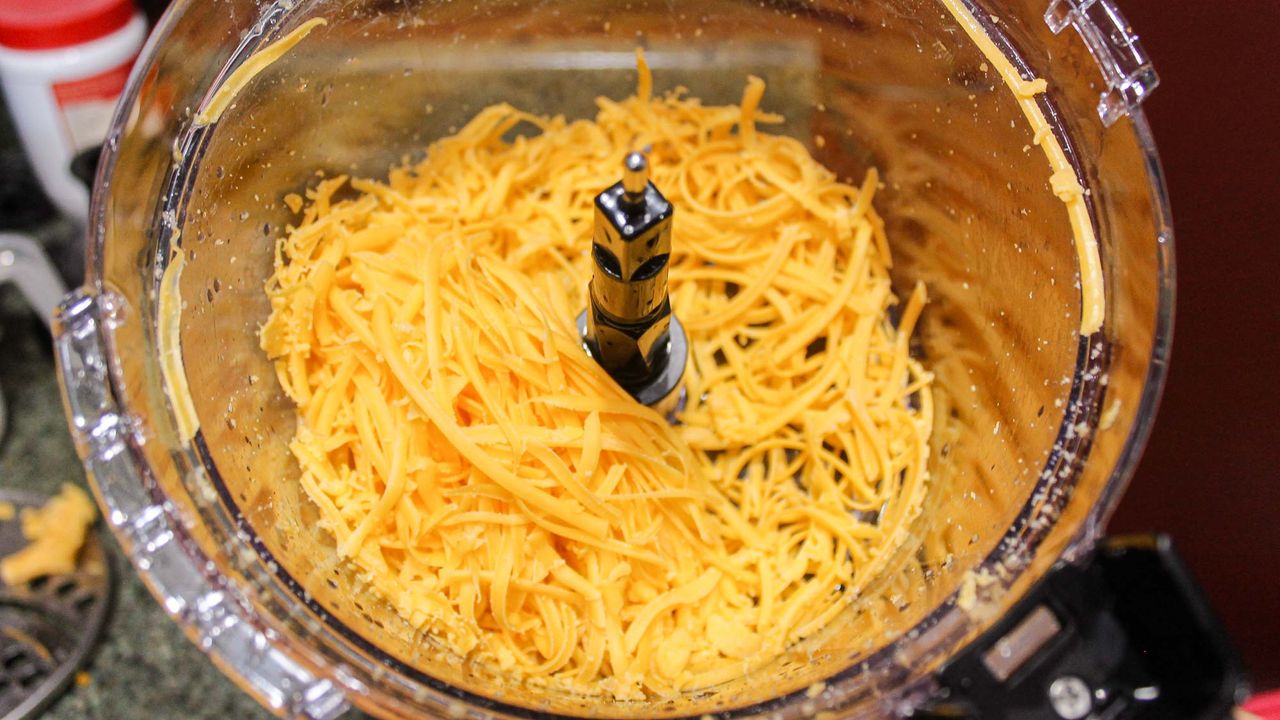 Hamilton Beach 12 Cup Stack and Snap Food Processor processing cheese