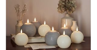 ball LED candles on a bedroom side table to show how to make a bedroom cosy