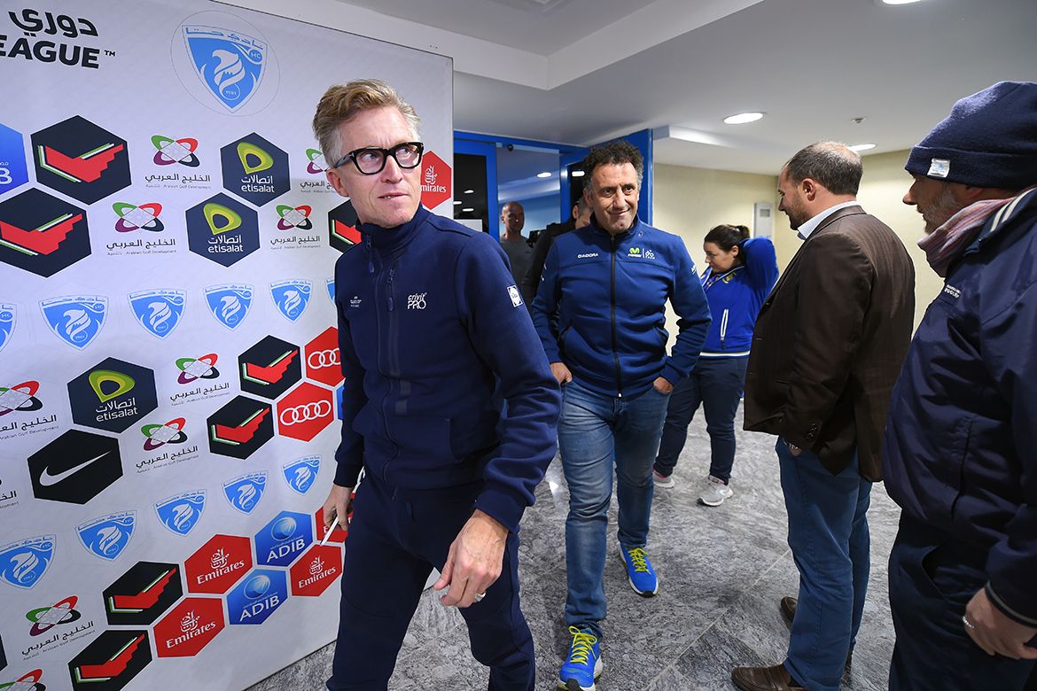 Brian Holm of Quick-Step floors walk out of the meeting