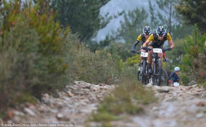 Overall leaders, Team RE:CM's Erik Kleinhans (front) and Waylon Woolcock negotiate stoney climb during stage 5