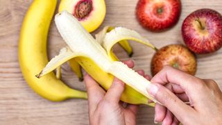 Peeling a banana for a pre-run snack