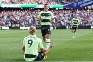 Erling Haaland is joined by Phil Foden as he celebrates a goal for Manchester City against West Ham in August 2022.