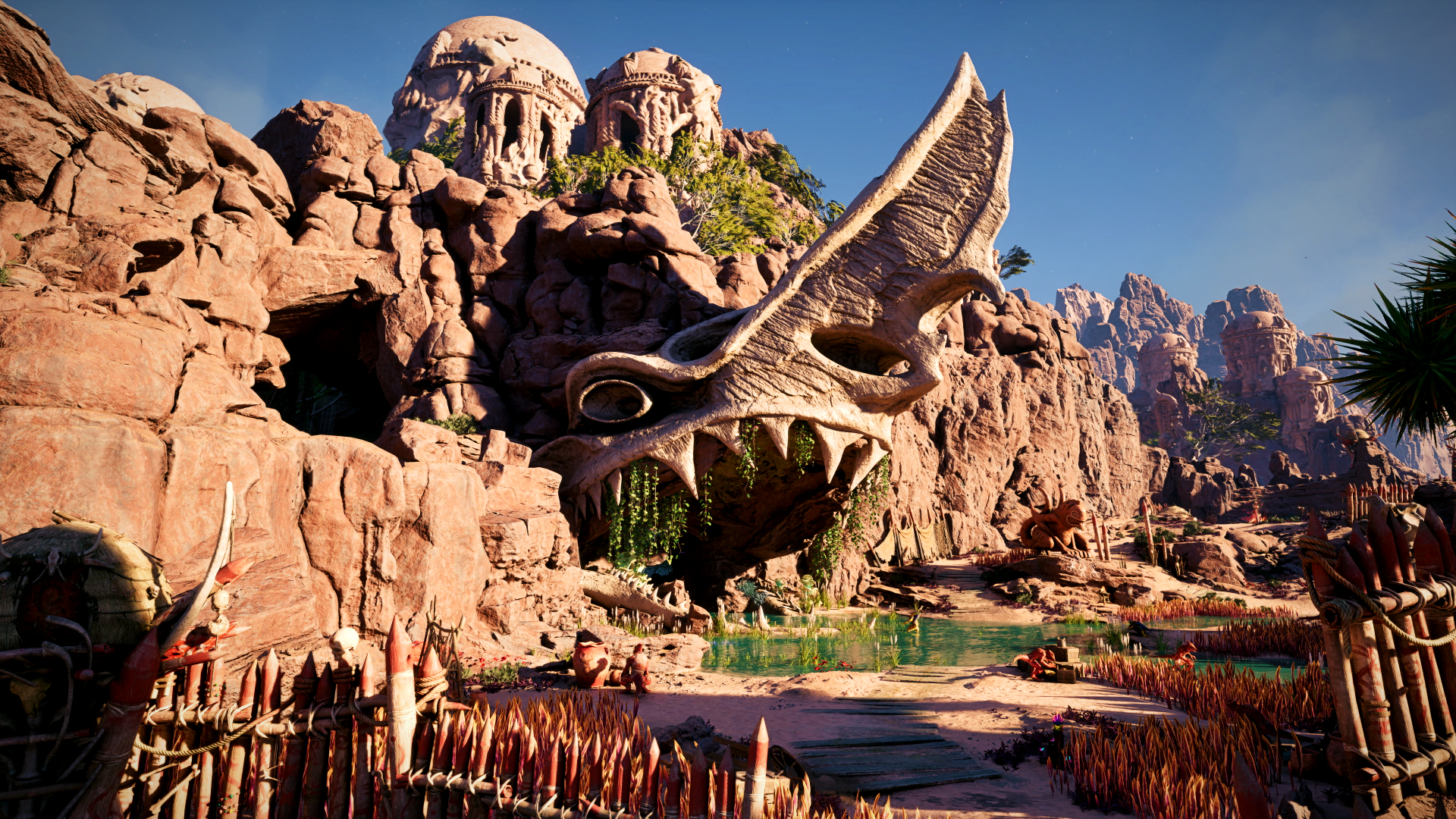 Avowed screenshot showing a rocky desert cave opening, styled as the open mouth of a spike-y toothed creature