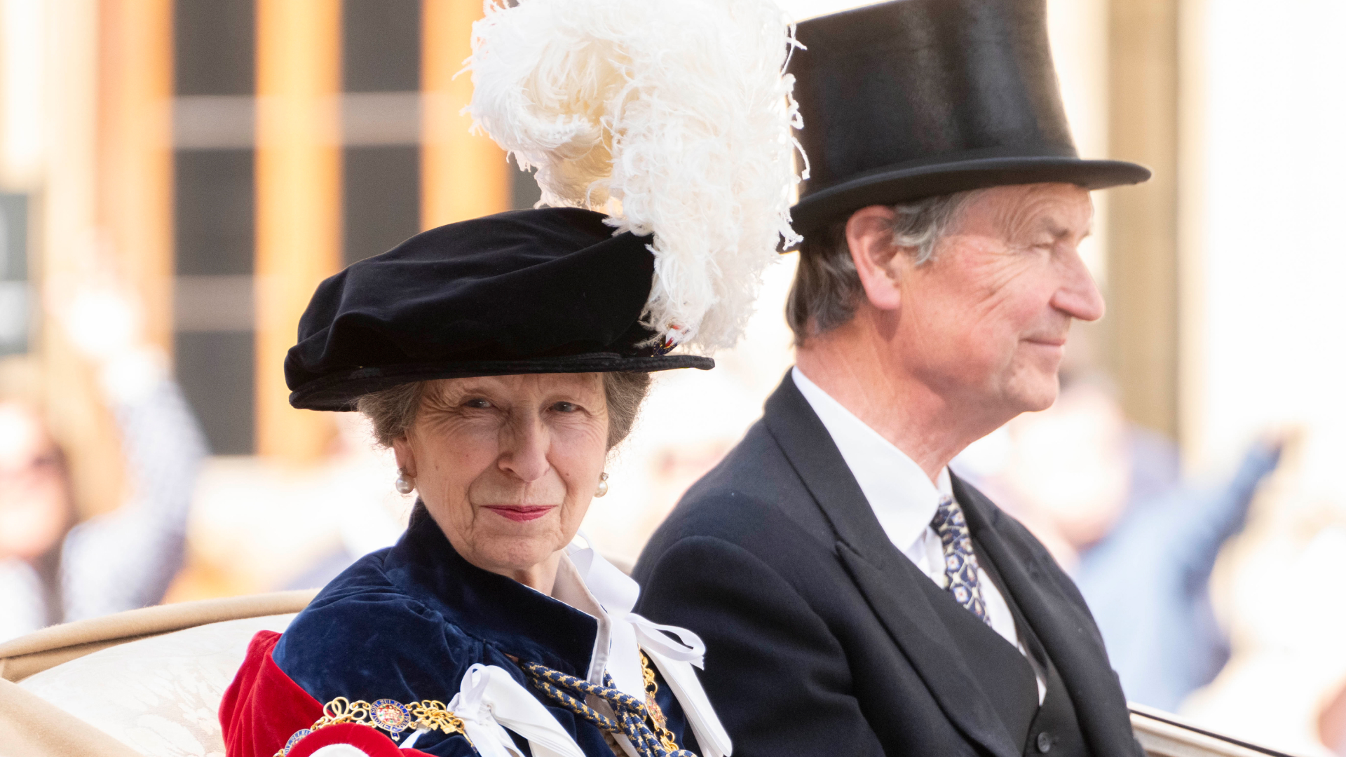 Princess Anne rides in a carriage with husband Sir Timothy Laurence