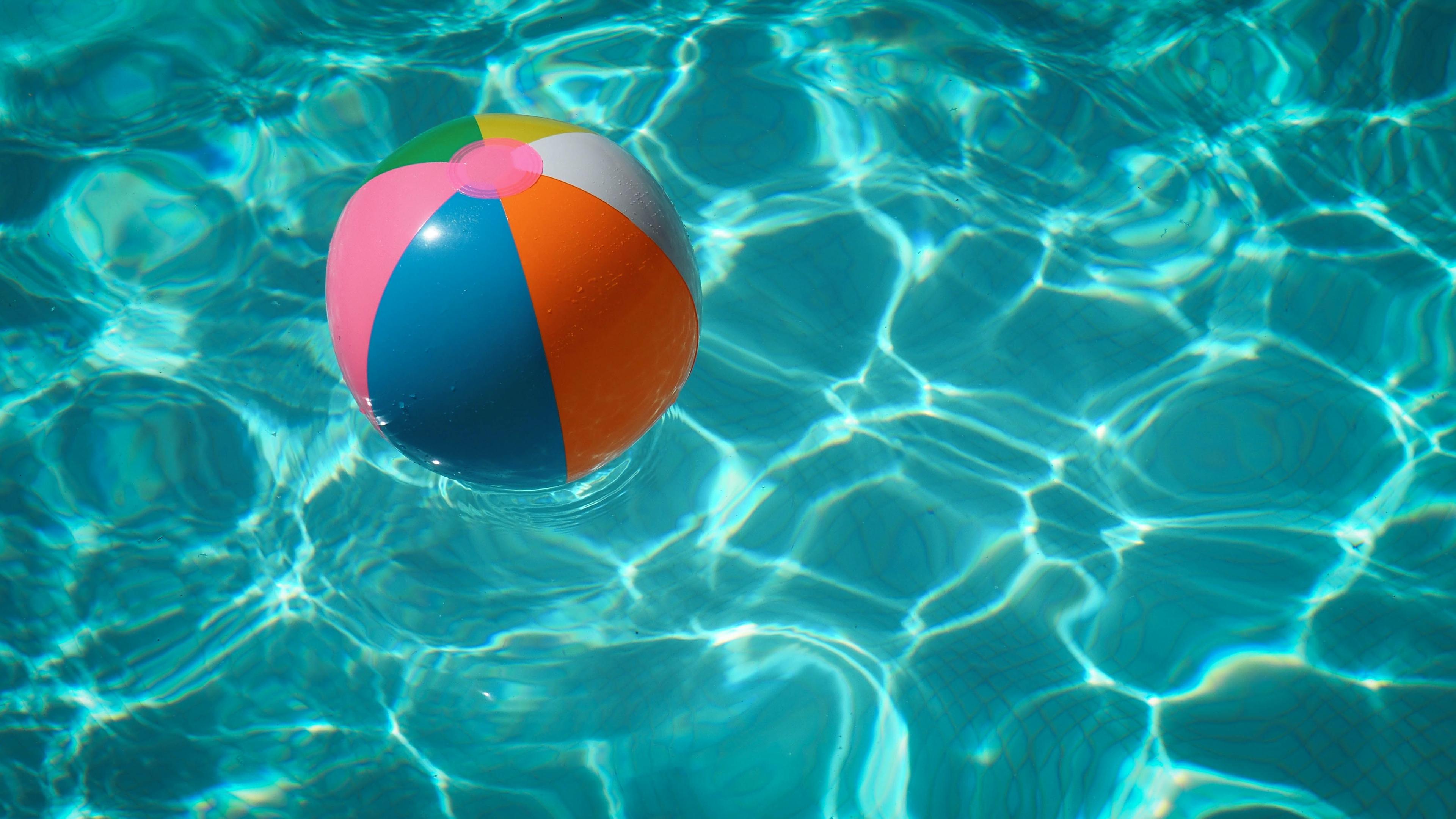  A beach ball in a pool. 