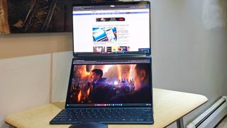 Lenovo Yoga Book 9i Gen 2 unfolded on a desk to show the dual-screens