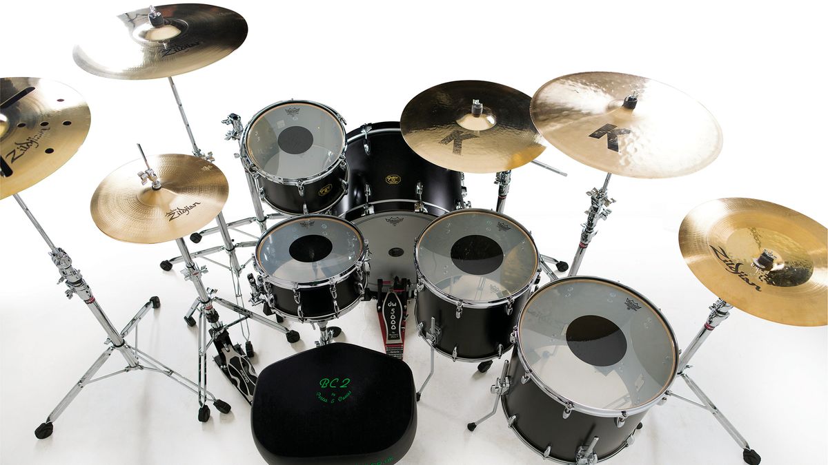 Drums - Gretsch USA custom kit: 24"x18" bass drum; 13"x8" tom; 16"x15" &amp; 18"x16" floor tom; 14"x7" snare drum; 10" Gretsch steel side snare. Cymbals - Zildjian: 15" K Light hats; 22" K Light ride; 21" K crash ride; 19" K Hybrid china; 20" EFX crash. Plus - Zildjian sticks, Remo heads, Gibraltar hardware, Porter &amp; Davies monitor