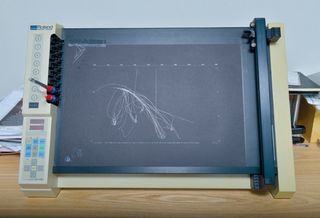 A plotter from the 80s that Lee- Delisle used to make small prints from the LunarTrails project