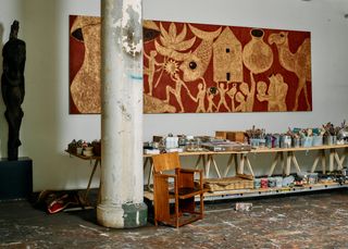 Francesco Clemente studio with gold and red wall frieze