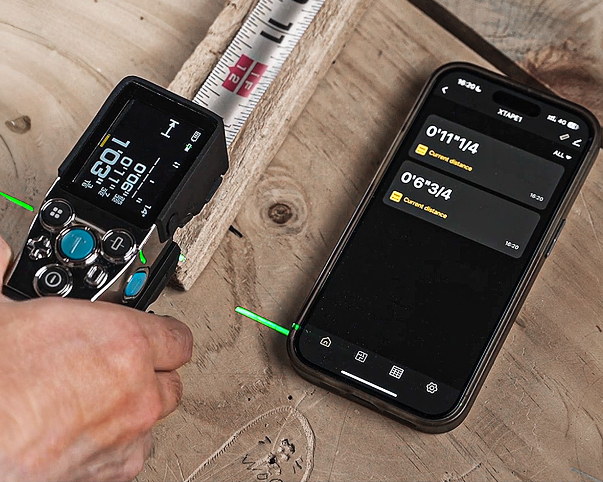 XTAPE1 digital measuring tape and app in use whilst measuring a piece of wood, on a wooden DIY table