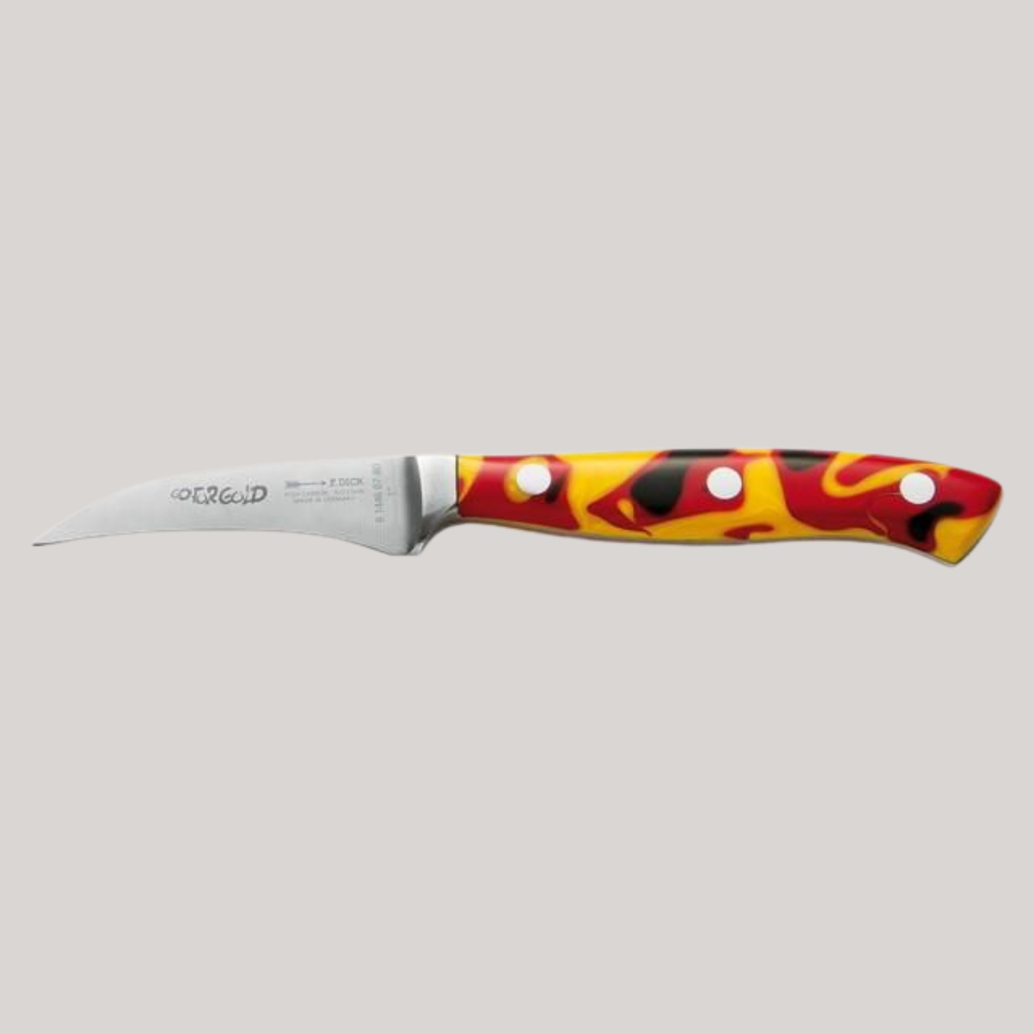 A silver turning knife with red, yellow, and black handle, sat horizontally against a pale grey background.