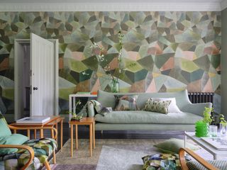 Living room in green by Designers Guild
