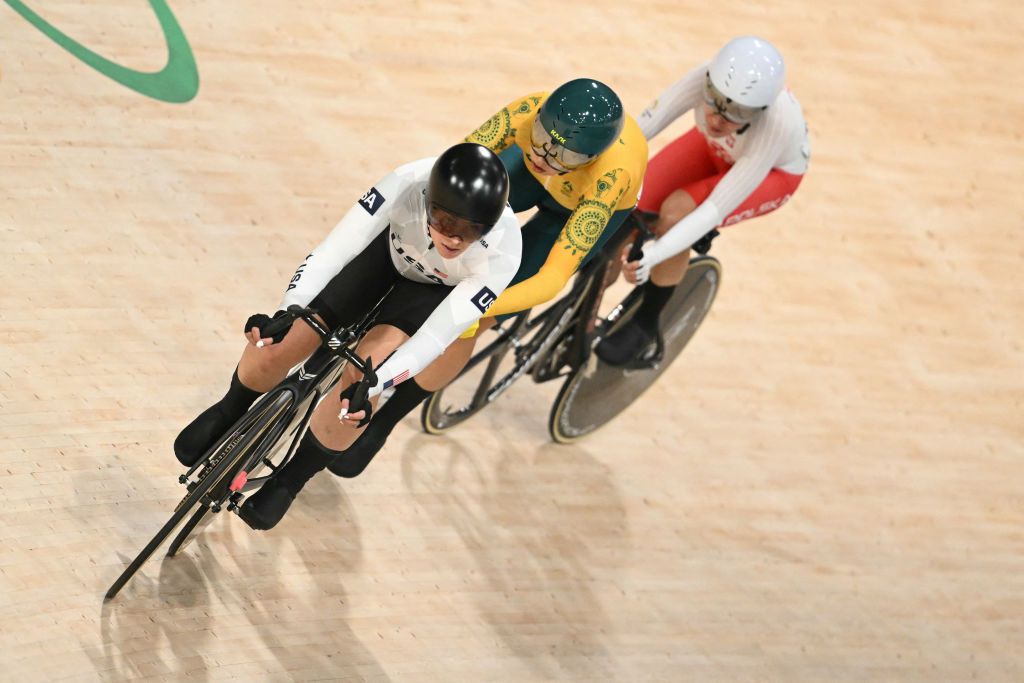 (From L) US' Jennifer Valente, Australia's Georgia Baker and Poland's Daria Pikulik compete in the women's track cycling omnium tempo race of the Paris 2024 Olympic Games at the Saint-Quentin-en-Yvelines National Velodrome in Montigny-le-Bretonneux, south-west of Paris, on August 11, 2024. (Photo by SEBASTIEN BOZON / AFP)