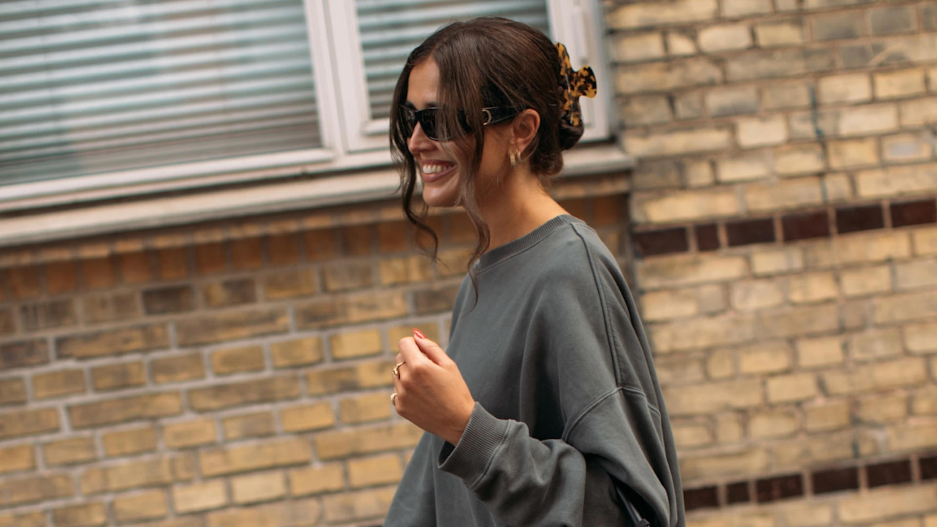 Woman wearing a gray sweater