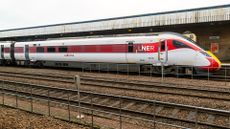 LNER logo pictured on stationary train parked at Lincoln Station, UK.