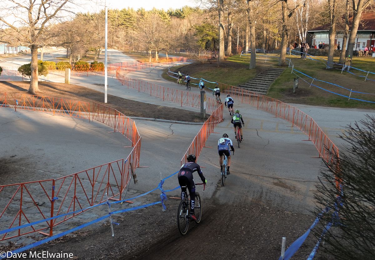 Riders head out onto a pavement section of the course at Goddard State Park