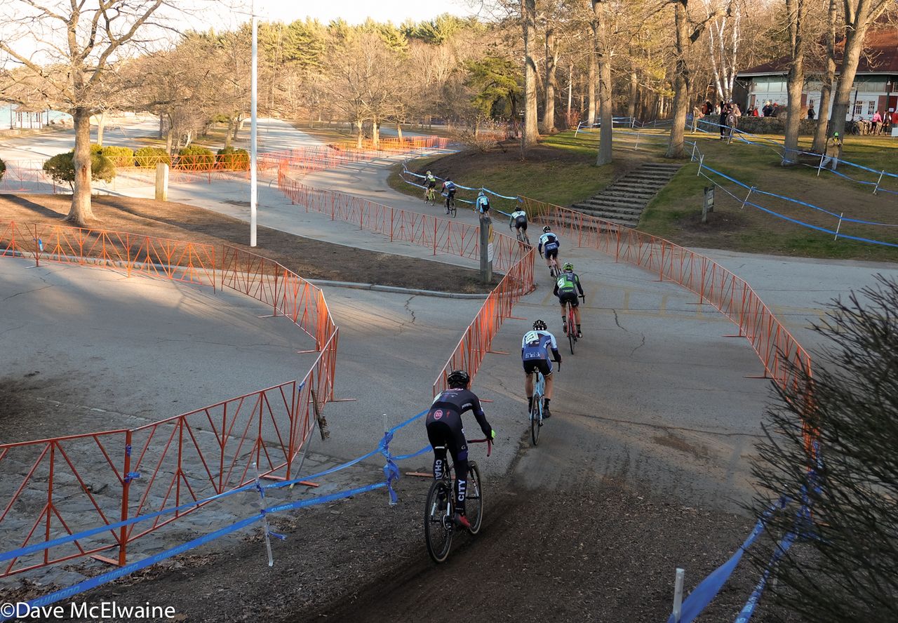 Riders head out onto a pavement section of the course at Goddard State Park