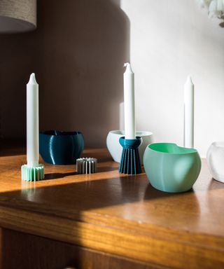 3D printed candleholders on sideboard