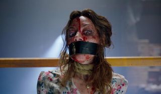 Child's Play (2019) Aubrey Plaza bound and bloody, looking frightened