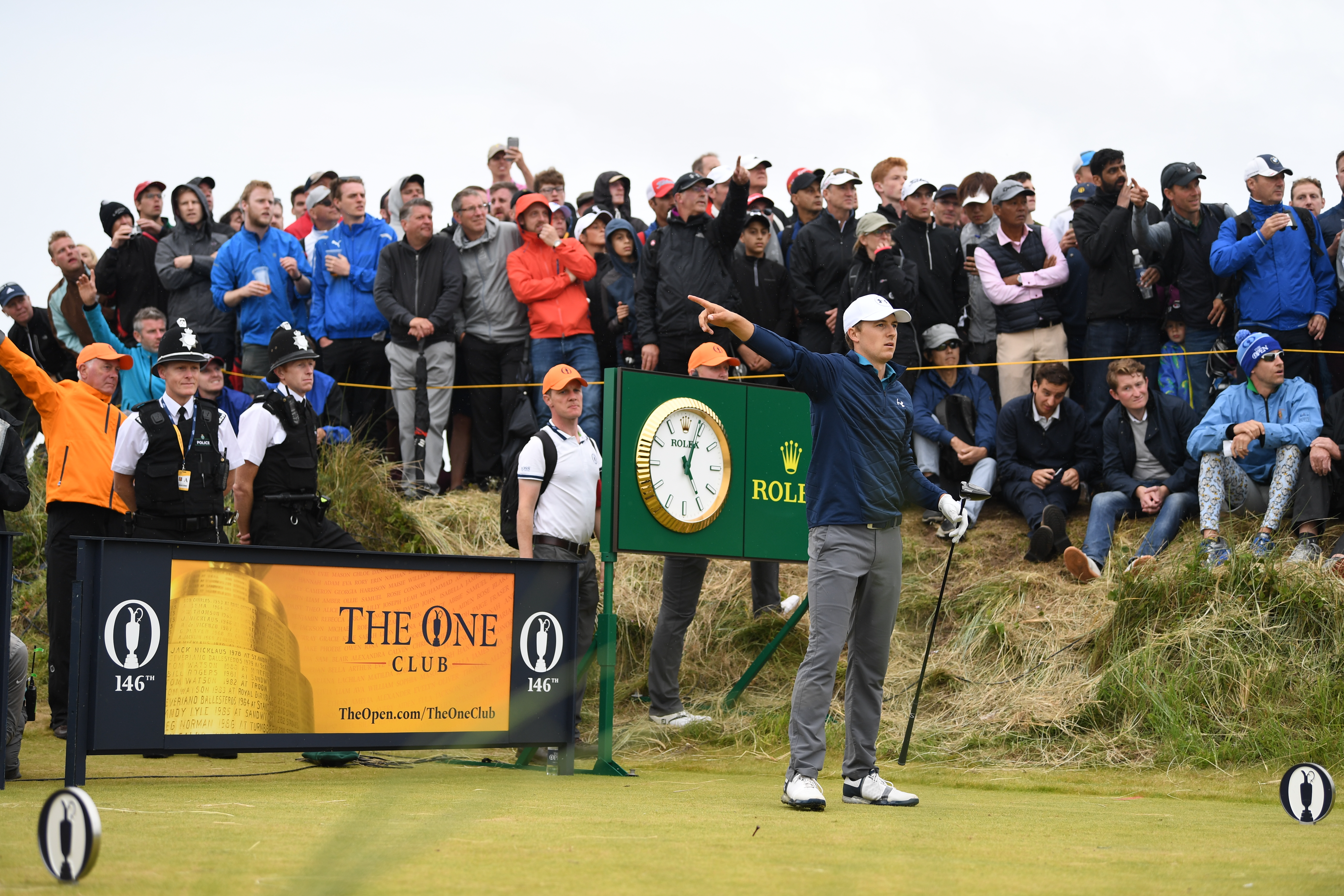 Jordan Spieth points right after hitting a wayward drive at the 2017 Open